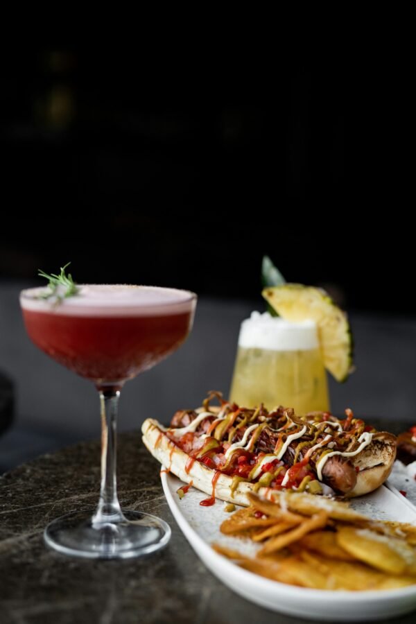 Meal on Plate and Glasses of Cocktails