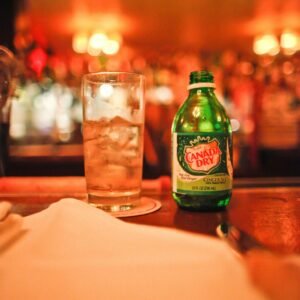 Canada Dry Bottle Beside A Drinking Glass